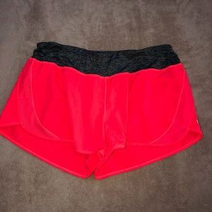 NEON PINK RUNNING SHORTS